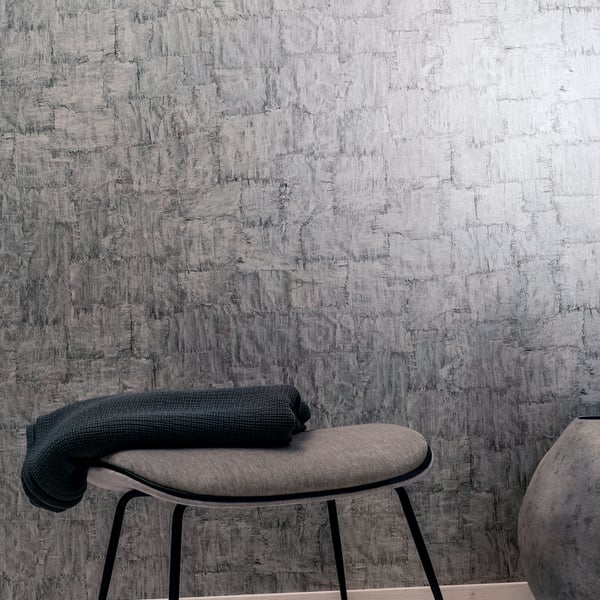 Galerie Wallpaper Product code: 95016_2 - Air Wallpaper Collection - Silver Colours - This utterly gorgeous wallpaper captures the texture of torn bark. The natural texture with a subtle sheen exudes tranquillity. The light dances across the surface, making this an excellent choice for smaller rooms or hallways that need that lift to give them a feeling of enhanced space. Perfect across all four walls, it can also be coordinated with a complementary design to create an interior full of lustre and sophistication.  Design